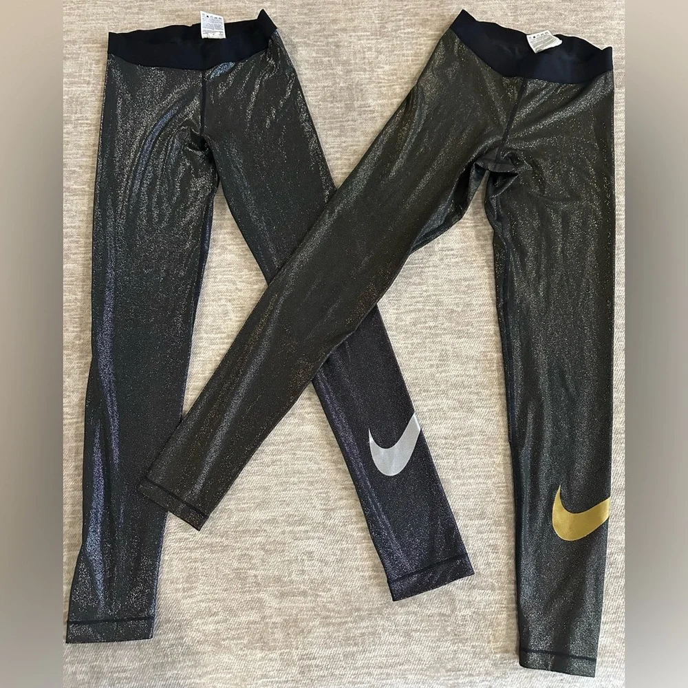 Lot of 2: Nike, glitter leggings w/leg logo. One silver, one gold. Both sz med - Picture 1 of 9